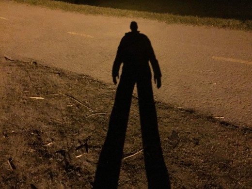 A man in the shadows.