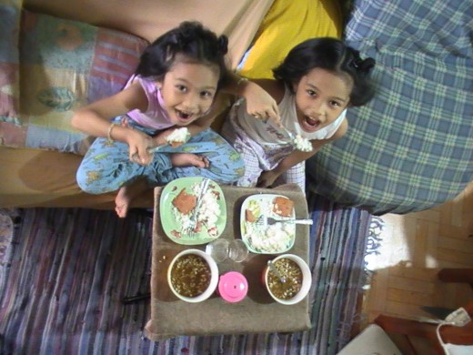The twins, Denise Rae & Demi Rae (from left to right), eating their brunch.