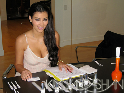 Kim Kardashian smelling perfume samples