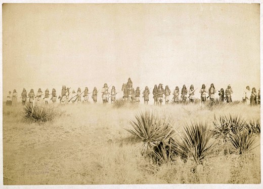 "Scene in Geronimo's camp, the Apache outlaw. Taken before the surrender to Gen. Crook, March 27, 1886, in the Sierra Madre mountains of Mexico, escaped March 30, 1886."