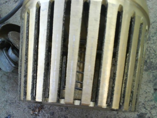 A close-up of foot valve: spring is visible.