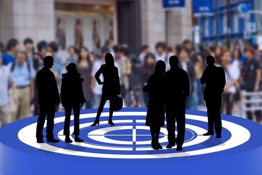 Several dark silhouettes of unrelated people standing in the same circle - Image by Gerd Altmann from Pixabay