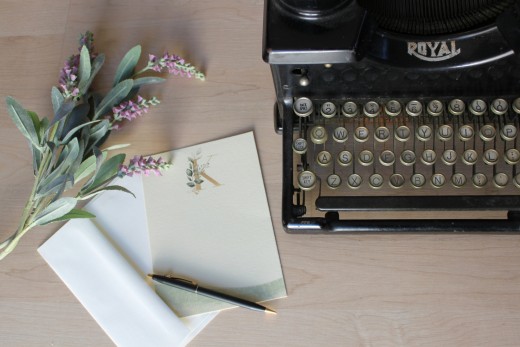 White printer paper on black typewriter, photo by Susan Weber on Unsplash