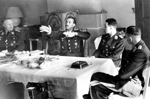 Adolf Galland, using hand motions, and Werner Molders, to Galland's left, 1941.  Majors Falke & Fohn, Battle of Britain movie characters were based of these Galland and Molders.  
