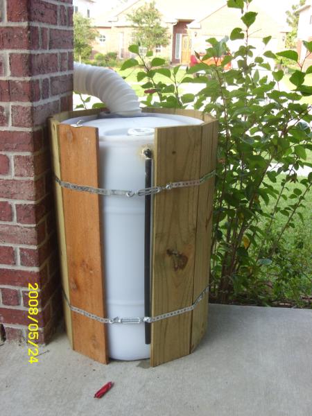 You can see that the plastic barrel is trying to impersonate an old time water barrel.