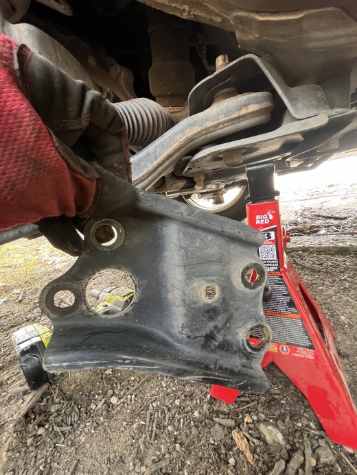 Sway bar bushing cover plate removed.