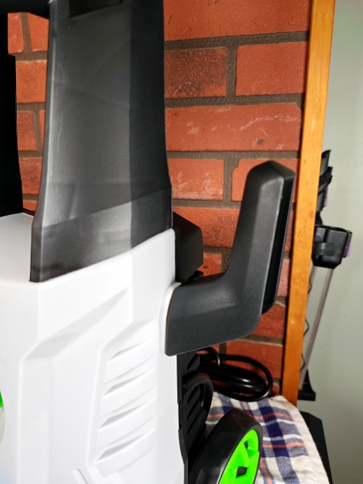 The coiled power cable holder has been slid into place