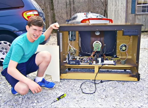 Grantley Waters showing the chassis of the 1986 Curtis Mathes Color Television with Stereo Sound. Model A2529RC. Made in Texas by Americans who took pride in their work. I was on the design team of this television, it had an amazing picture tube.