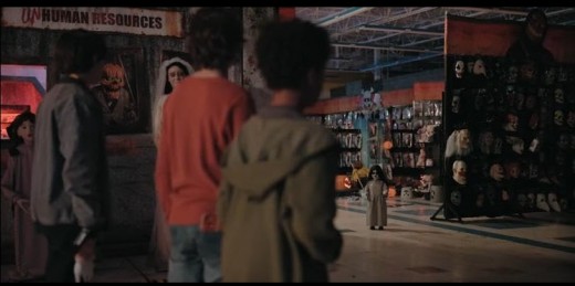 Best friends Jake (Donovan Colan-L) Carson (Dylan Martin Frankel-C) and Bo (Jaiden J. Smith) encounter a creepy doll that just appeared as they go looking for a noise at Spirit Halloween