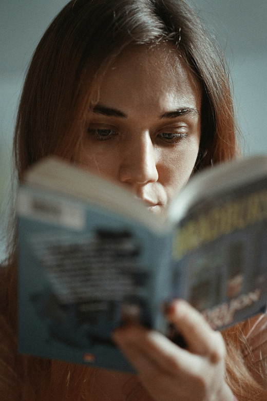 Woman holding book to read, photo by Hanna Balan on Unsplash Woman holding book to read, photo by Hanna Balan on Unsplash