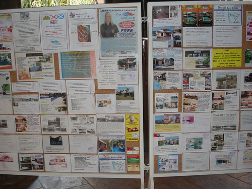 Notice board listing apartments to rent...negotiable