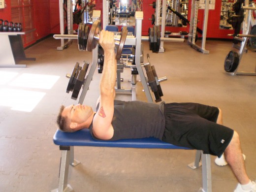 Flat Bench Dumbbell press up position
