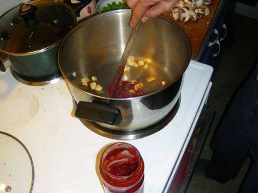 Add 1 tablespoon sweet red pepper (or tomato) paste