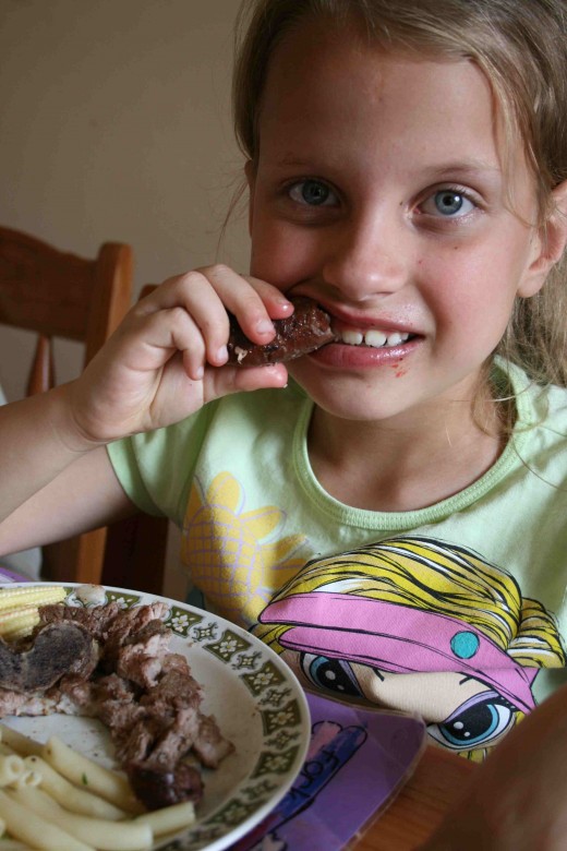 Caitlin tucking into some boerewors