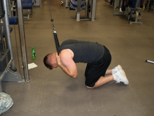The Cable Crunch down position