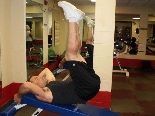 The Decline Bench Reverse Crunch up position