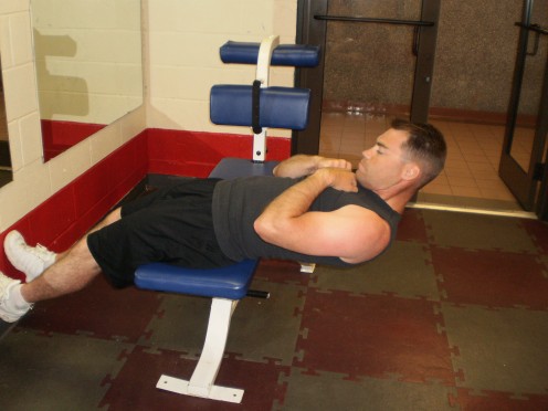 The Roman Chair with Russian Twist start position