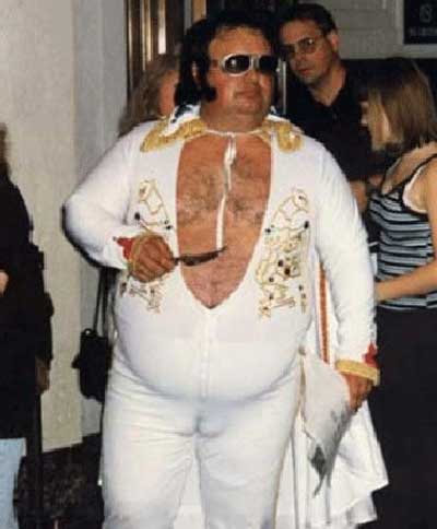 It's unclear if he is supposed to be John Belushi or Elvis, or Belushi channeling Elvis.