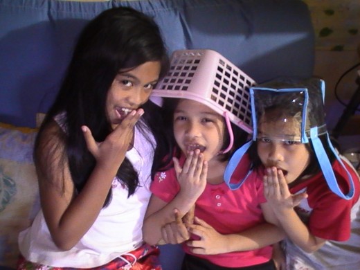The twins with their elder sister, Jana Kris