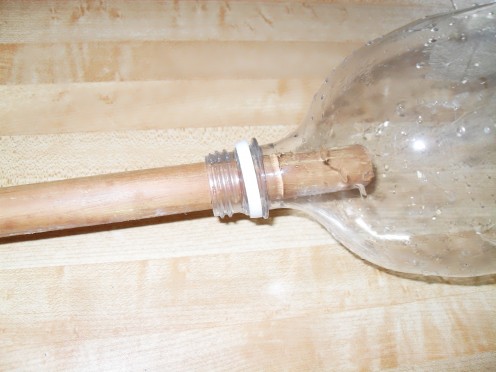 This photograph shows how easily the wood dowel goes inside the bottle.