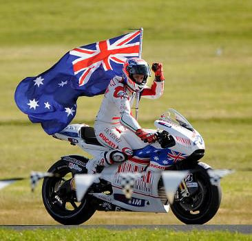 Casey Stoner proudly Australian with flag after winning the GP