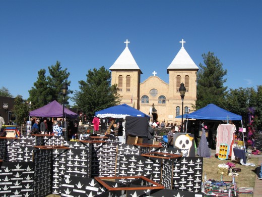 El Día de los Muertos celebration in La Mesilla, NM with St. Albino Basilica in background.
