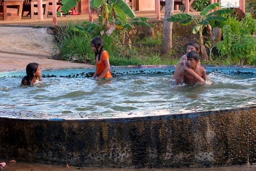Some of the kids playing in the pool. The girl in orange was the really smart one.