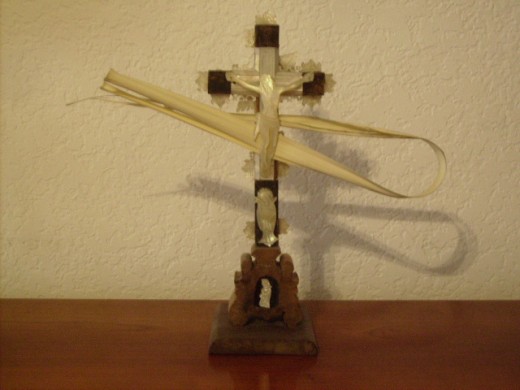 A crucifix with palm leaves. 