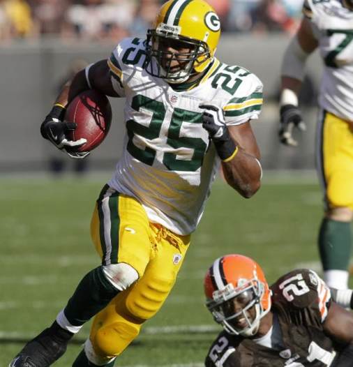 Green Bay Packers running back Ryan Grant (25) breaks away from Cleveland Browns safety Brodney Pool (21) on a 37-yard run in the fourth quarter of an NFL football game Sunday, Oct. 25, 2009, in Cleveland. Grant ran for 148 yards and a touchdown in t