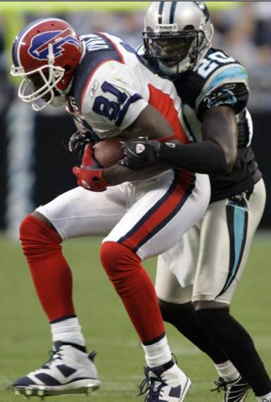 Buffalo Bills' Terrell Owens (81) is tackled by Carolina Panthers' Chris Gamble (20) in the second half of an NFL football game in Charlotte, N.C., Sunday, Oct. 25, 2009. (AP Photo/Nell Redmond)