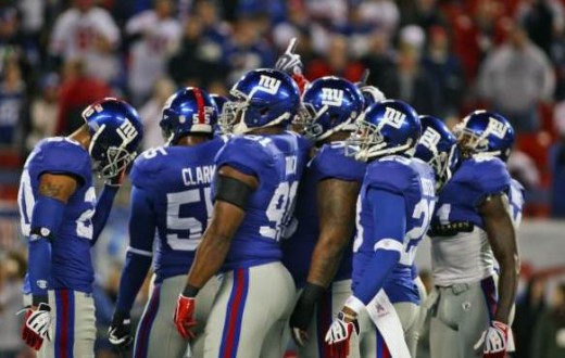 New York Giants defense huddles during the first quarter an NFL football game against the the Arizona Cardinals Sunday, Oct. 25, 2009, in East Rutherford, N.J. (AP Photo/Tim Larsen)