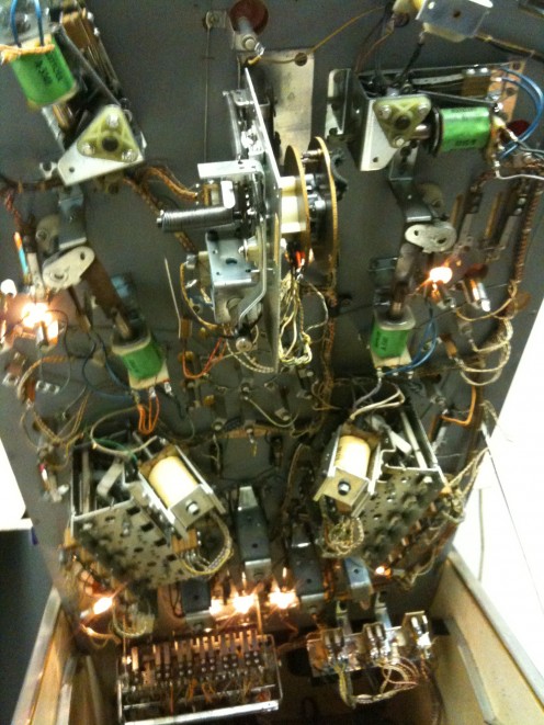Inside of bumper and paddle relays and lights.
