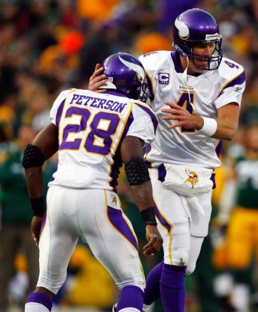 Minnesota Vikings quarterback Brett Favre (4) celebrates with running back Adrian Peterson (28) after scoring a touchdown against the Green Bay Packers on Sunday, November 1, 2009. (Ben Liebenberg/NFL.com)