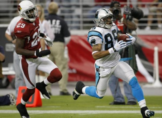 Carolina Panthers wide receiver Steve Smith (89) scores a touchdown as Arizona Cardinals cornerback Dominique Rodgers-Cromartie (29) pursues during the first half of an NFL football game Sunday, Nov. 1, 2009, in Glendale, Ariz. (AP Photo/Matt York)