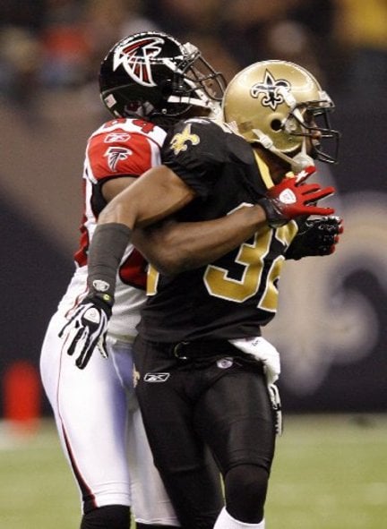 Atlanta Falcons receiver Roddy White prepares to break loose from New Orleans Saints cornerback Jabari Greer for a 68-yard touchdown reception Monday night at the Superdome.