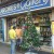 Decorated Christmas tree in front of a Xmas Card Shopee Decorated Christmas tree in front of a Xmas Card Shopee