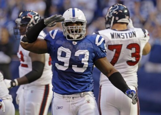 Indianapolis Colts defensive end Dwight Freeney (93) reacts after a sack of Houston Texans quarterback Matt Schaub during the second quarter of an NFL football game in Indianapolis, Sunday, Nov. 8, 2009. (AP Photo/Darron Cummings)
