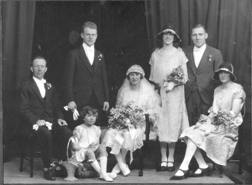 This wedding must have been the height of fashion,with the flapper dresses, and the low brimmed hats.