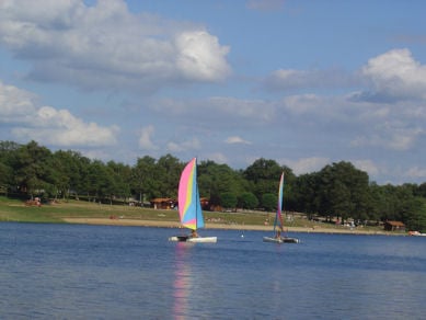 Hire boats or relax on the beach at Videix lake