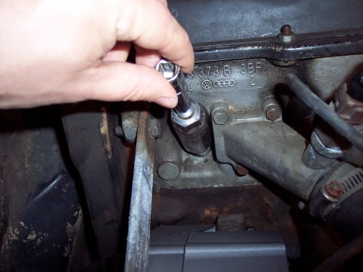 Do as much as you can with your fingers to avoid stripping out threads or breaking spark plug insulators.