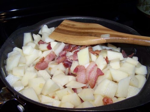 Potatoes, Onions and Bacon Frying. 