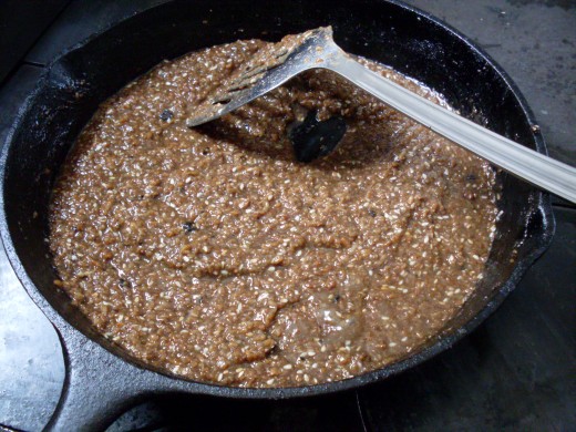...until the water has been almost all absorbed, and the bulgar makes sucking noises when you stir it. Add seeds or pine nuts, stir, then cover and cook a little more until the bulgar almost sticks to the bottom of the skillet. You're done.