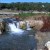 A waterfall that was created from the runoff coming from the hills!