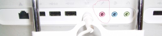 Sometimes the female connector is found at the back of the computer -- the 3.5 mm is circled in red. The rectangular female connectors are USB ports