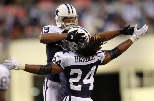Miles Austin (19) celebrates his touchdown with running back Marion Barber (24) in the first half of an NFL football game against the Oakland Raiders,, Thursday, Nov. 26, 2009, in Arlington, Texas. (AP Photo/Erich Schlegel)