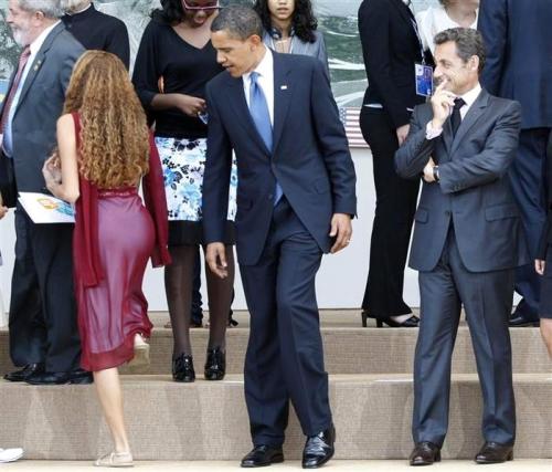 Notice how the President is admiring this 16 year old girls shoes...