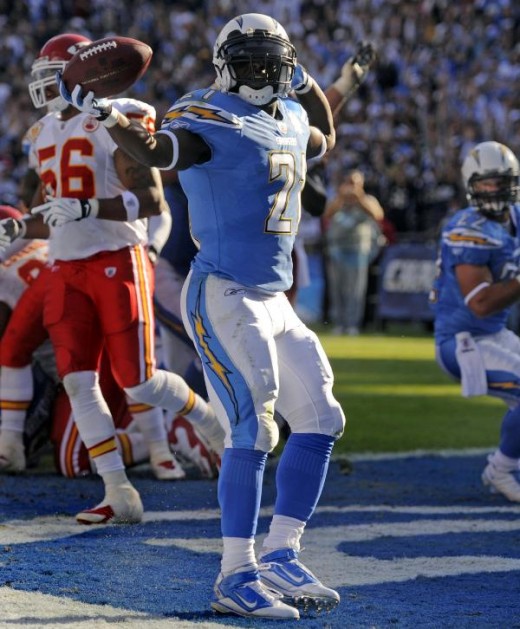 San Diego Chargers running back LaDainian Tomlinson, foreground, celebrates his one-yard touchdown run during the second quarter of n NFL football game against the Kansas City Chiefs on Sunday, Nov. 29, 2009, in San Diego. (AP Photo/Denis Poroy)
