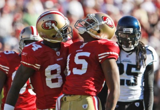 Michael Crabtree (15) celebrates with teammate Josh Morgan, left, after a reception in the second quarter (AP Photo/Paul Sakuma)