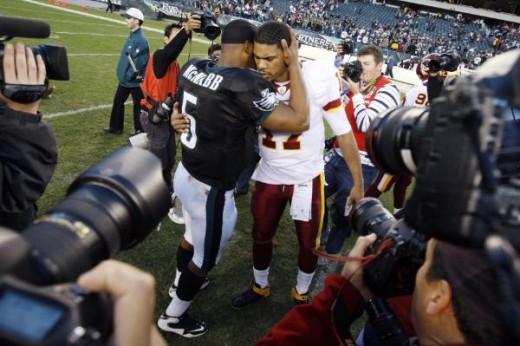 Donovan McNabb, center left, talks with Washington Redskins' Jason Campbell after an NFL football game, Sunday, Nov. 29, 2009, in Philadelphia. Philadelphia won 27-24. (AP Photo/Matt Slocum)
