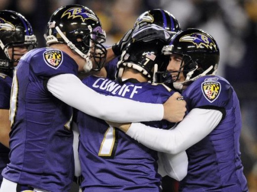 Billy Cundiff (7) is congratulated by snapper Matt Katula, left, and holder Sam Koch, right, after kicking the game-winning field goal in overtime to defeat the Pittsburgh Steelers 20-17 in an NFL football game Sunday, Nov. 29, 2009, in Baltimore. Th